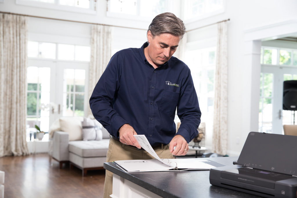Home Inspector reviewing report